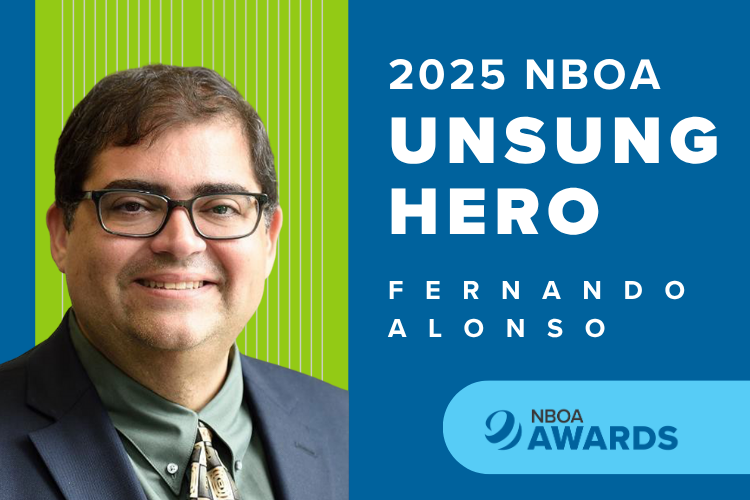 Photo of Fernando Alonso against a blue and green background