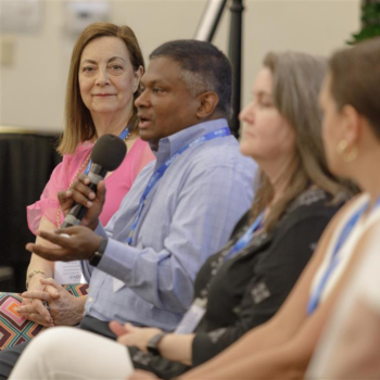 Lisa Turchan (left) sits on a leadership panel at the 2025 Business Officer Institute