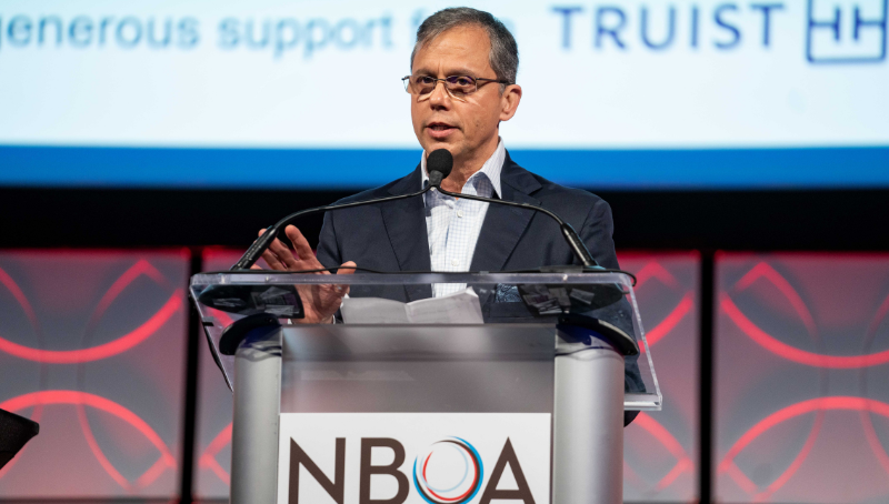 Man speaking at podium